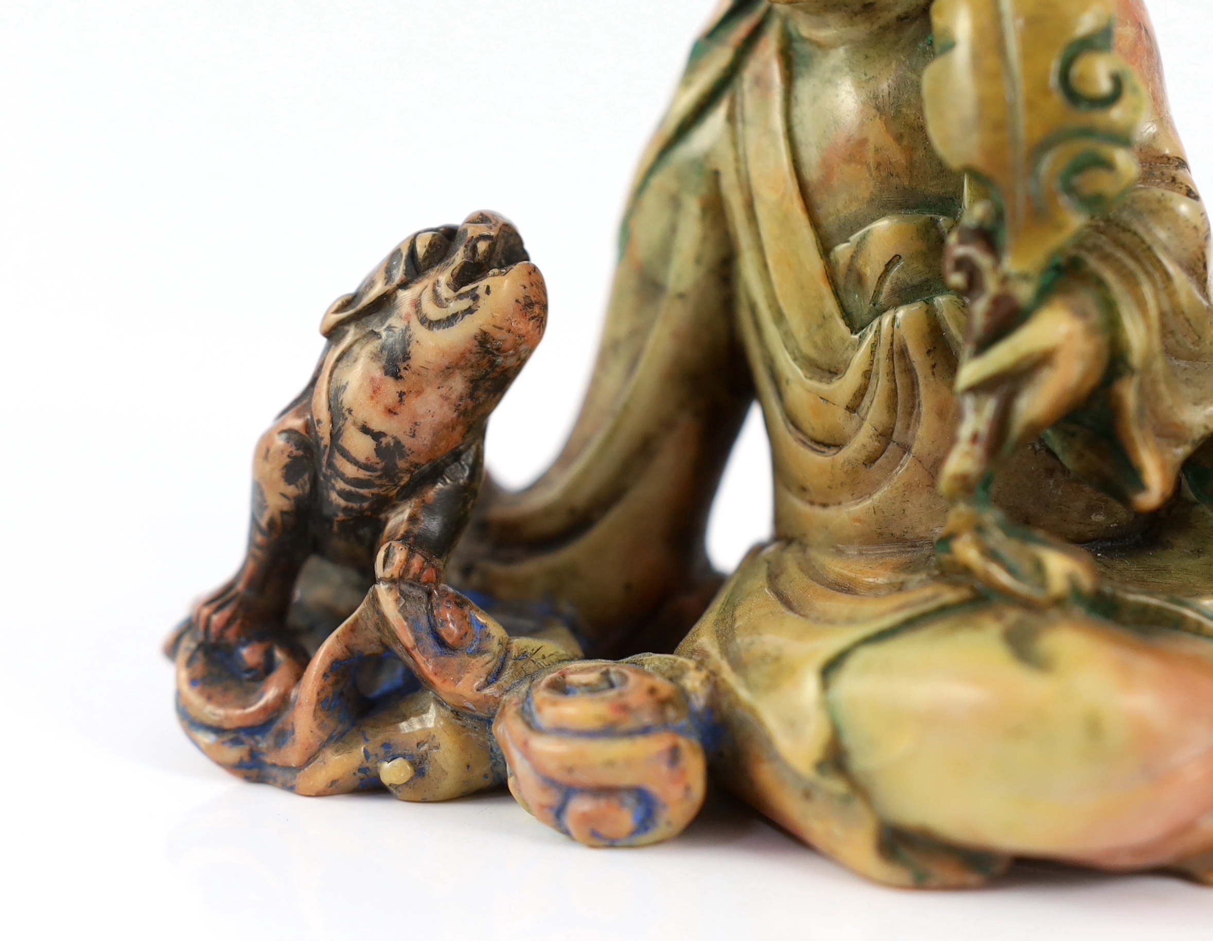 A Chinese soapstone group of a seated luohan and lion-dog, 19th/20th century